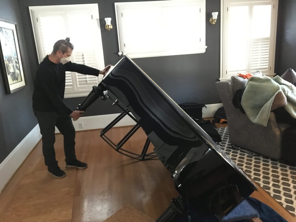 Clark tipping piano